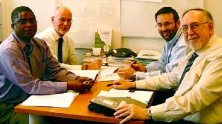 Project steering committee finalizing training activities. From left: Mike Nxele and Robert Shaw of ITU, and Marco Zennaro and Sandro Radicella of ICTP.  