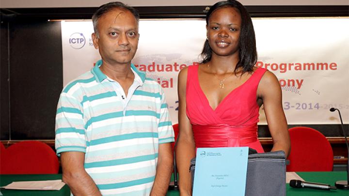 Chiamaka Okoli and Kumar Narain, the former head of ICTP's Postgraduate DIploma Programme, at the 2012 Diploma graduation ceremony 