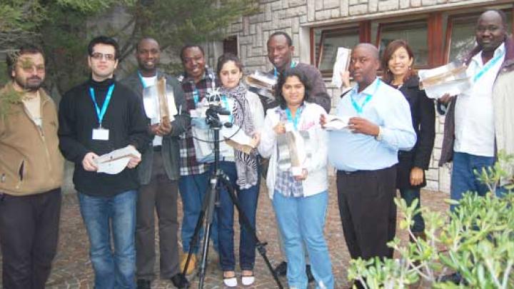 Workshop participants display their homemade antennas, built with help from ICTP lecturer Carlo Fonda (far left).